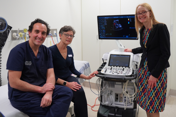 Austin Health Cardiology department standing with new cardio echo machine