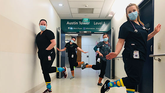 Our Executive team celebrate Crazy Socks 4 Docs