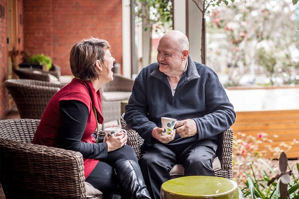 Volunteer talking to a patient