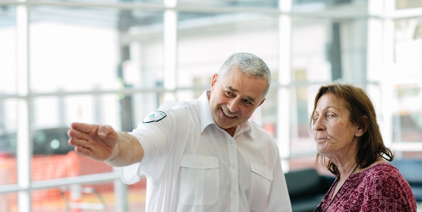 #caption79665 Security officer providing directions to a visitor