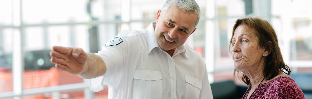 #caption79665 Security officer providing directions to a visitor