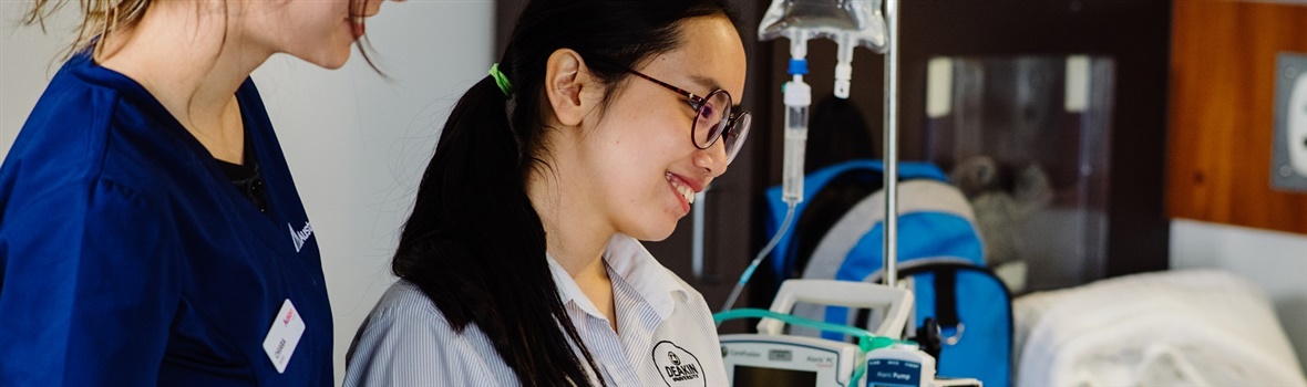 Student nurse with a staff member