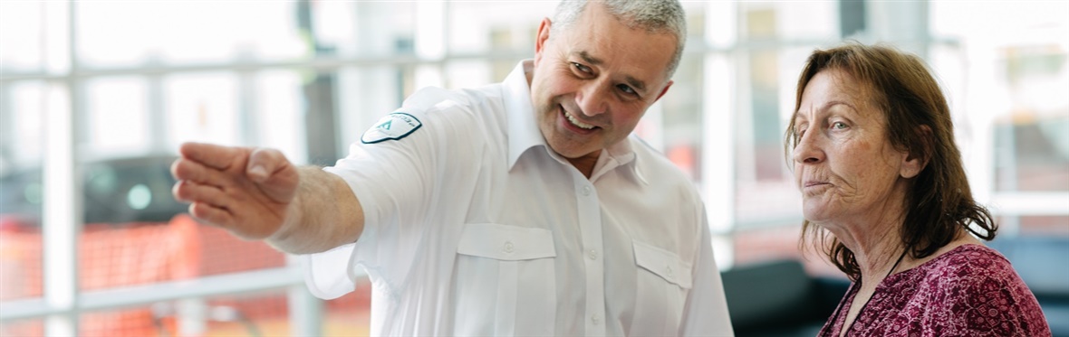 #caption79665 Security officer providing directions to a visitor