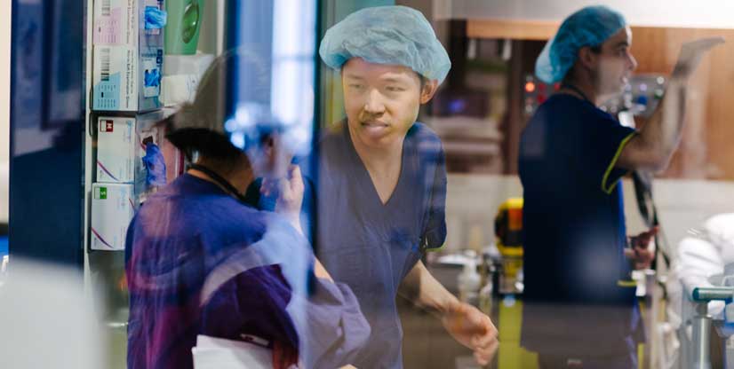 Staff in scrubs in the Cath Lab