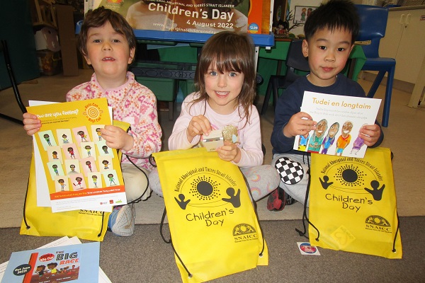 Liam, Harriet and Hugh with their Children's Day 2022 bag