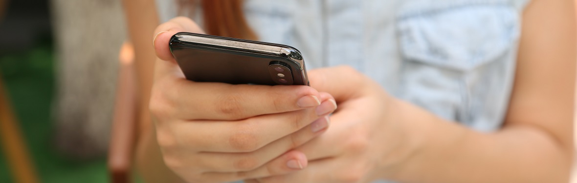 Woman holding mobile phone