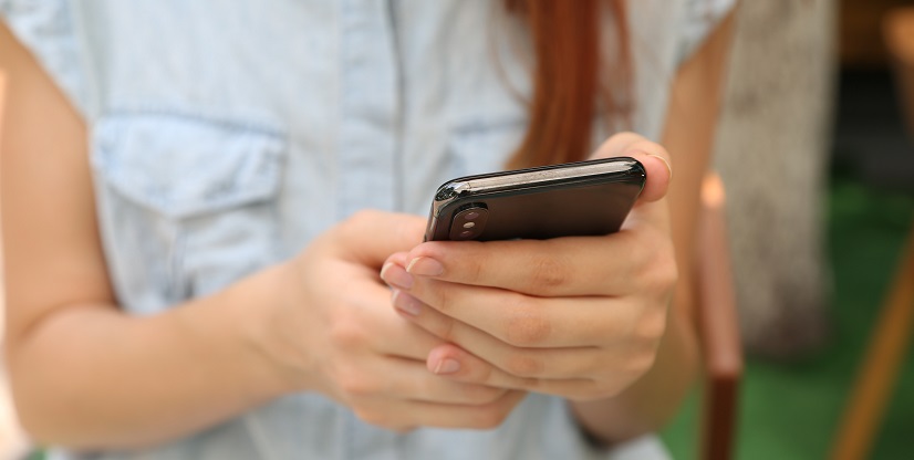 Woman holding mobile phone