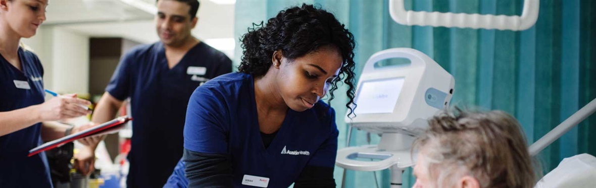 A nurse treats a patient in the Emergency Department